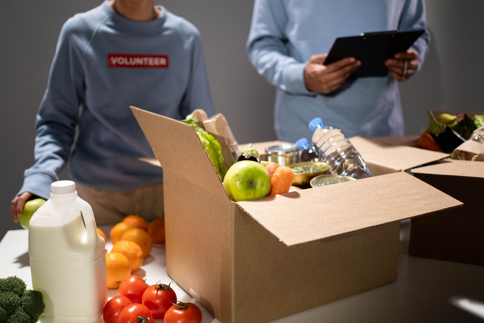 Volunteers packing food parcels for distribution